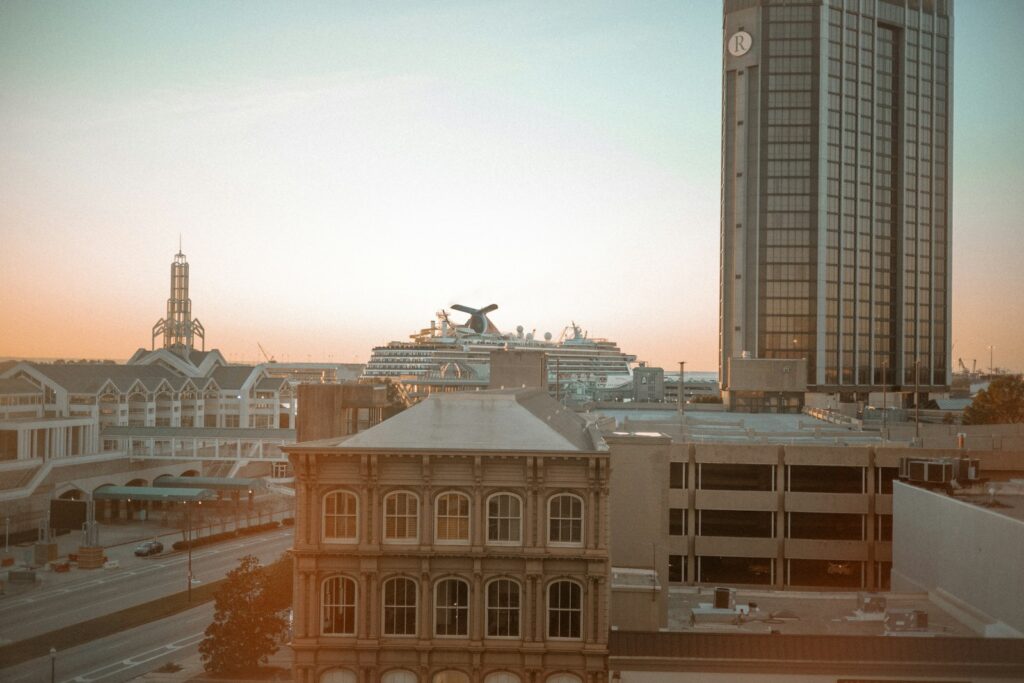 Alabama state a view of a city with a cruise ship in the background